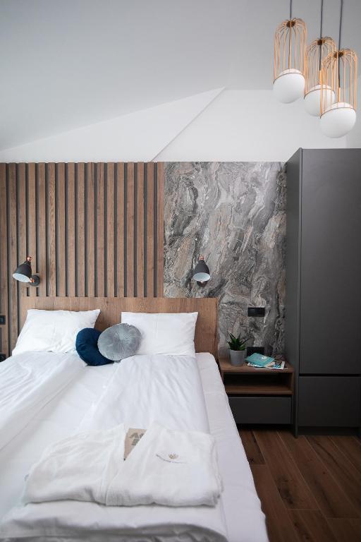 Postel nebo postele na pokoji v ubytování Tahiti Resort Apartments Hajdúszoboszló