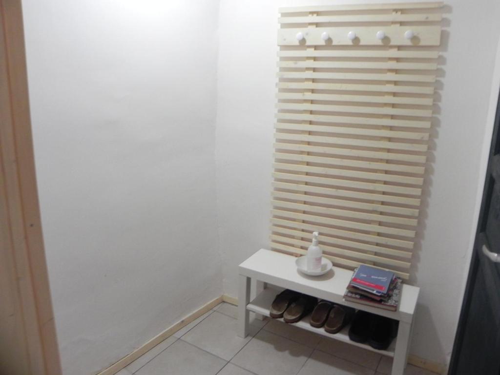 a white room with a table and a window at Apartmaji Hedera in Komen