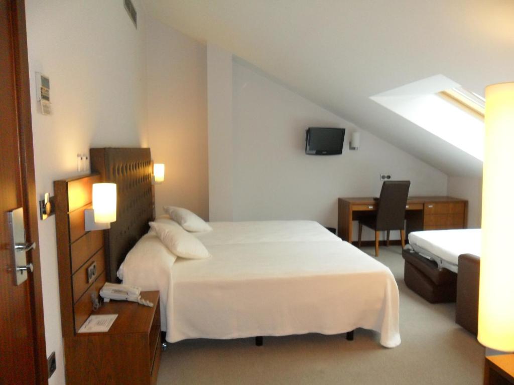 Postel nebo postele na pokoji v ubytování Hotel Anoeta