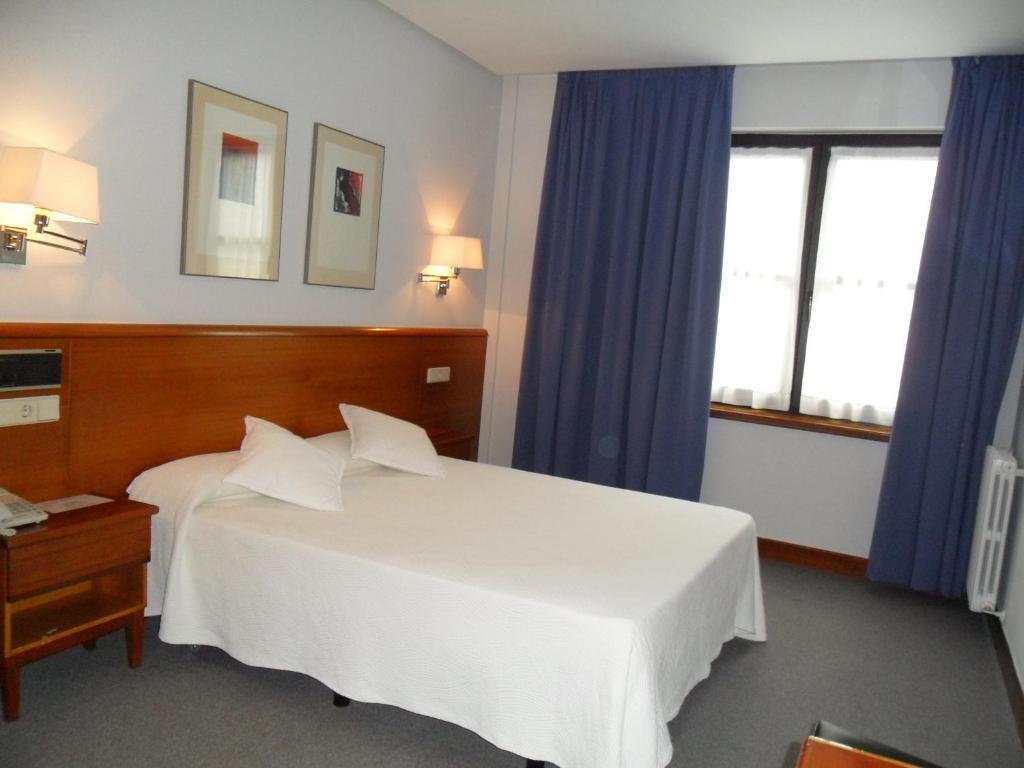 Postel nebo postele na pokoji v ubytování Hotel Anoeta
