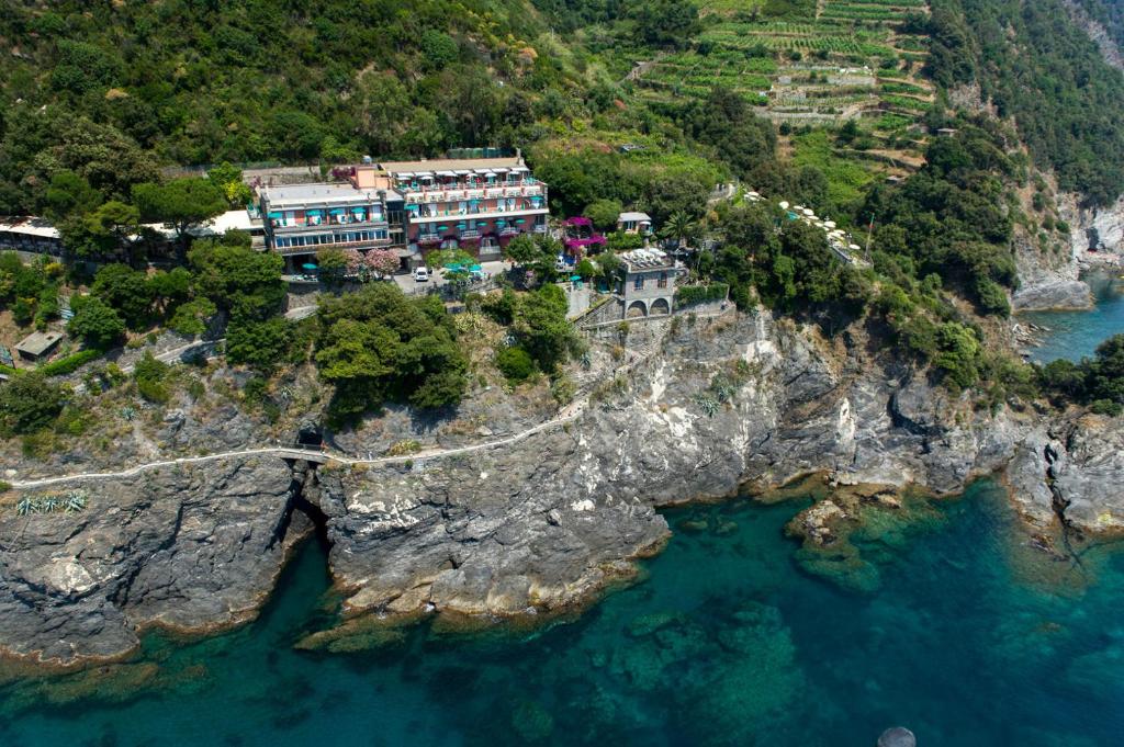 an aerial view of a mountain with a bridge over the water at Hotel Porto Roca in Monterosso al Mare