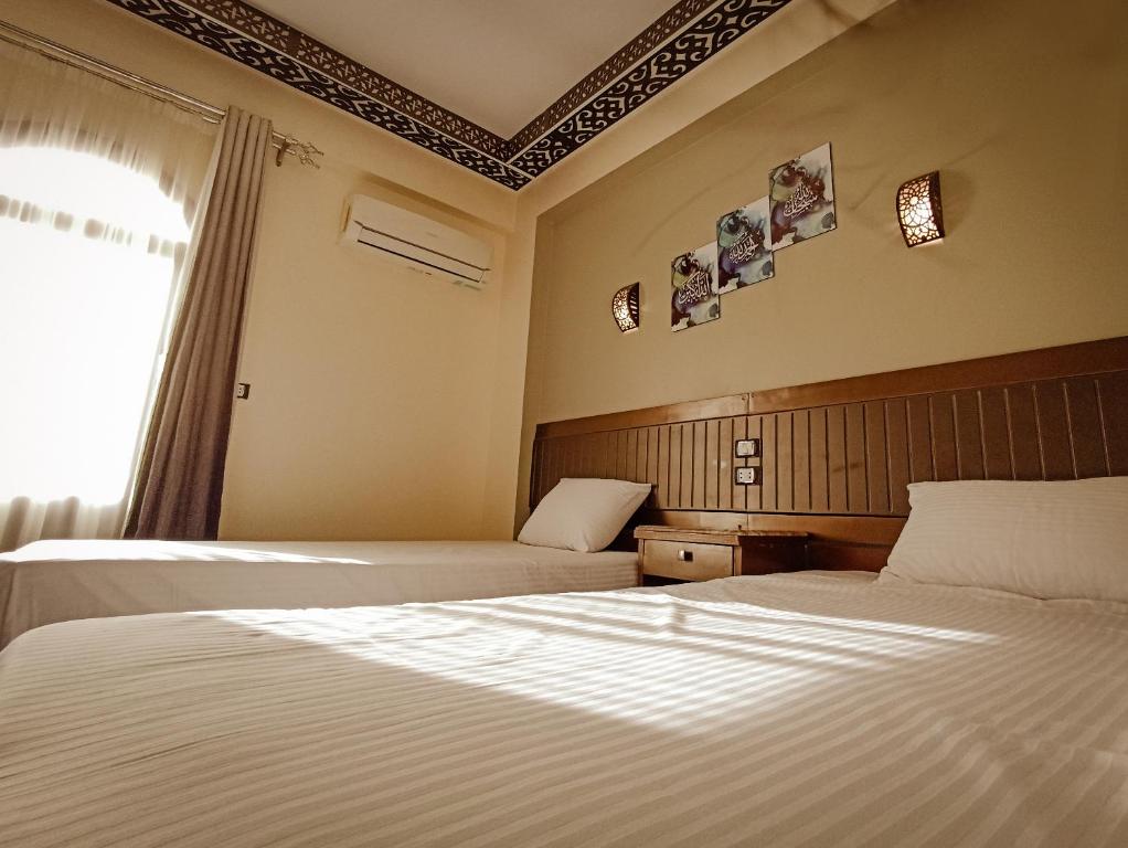 Postel nebo postele na pokoji v ubytování Shabana House