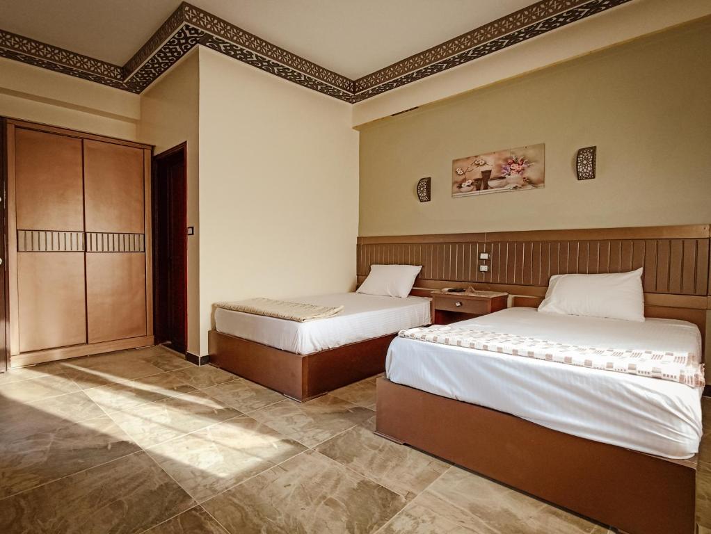 Postel nebo postele na pokoji v ubytování Shabana House