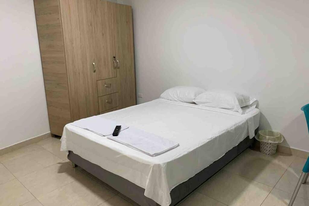 Łóżko lub łóżka w pokoju w obiekcie Fascinante apartaestudio NUEVO en Champagnat