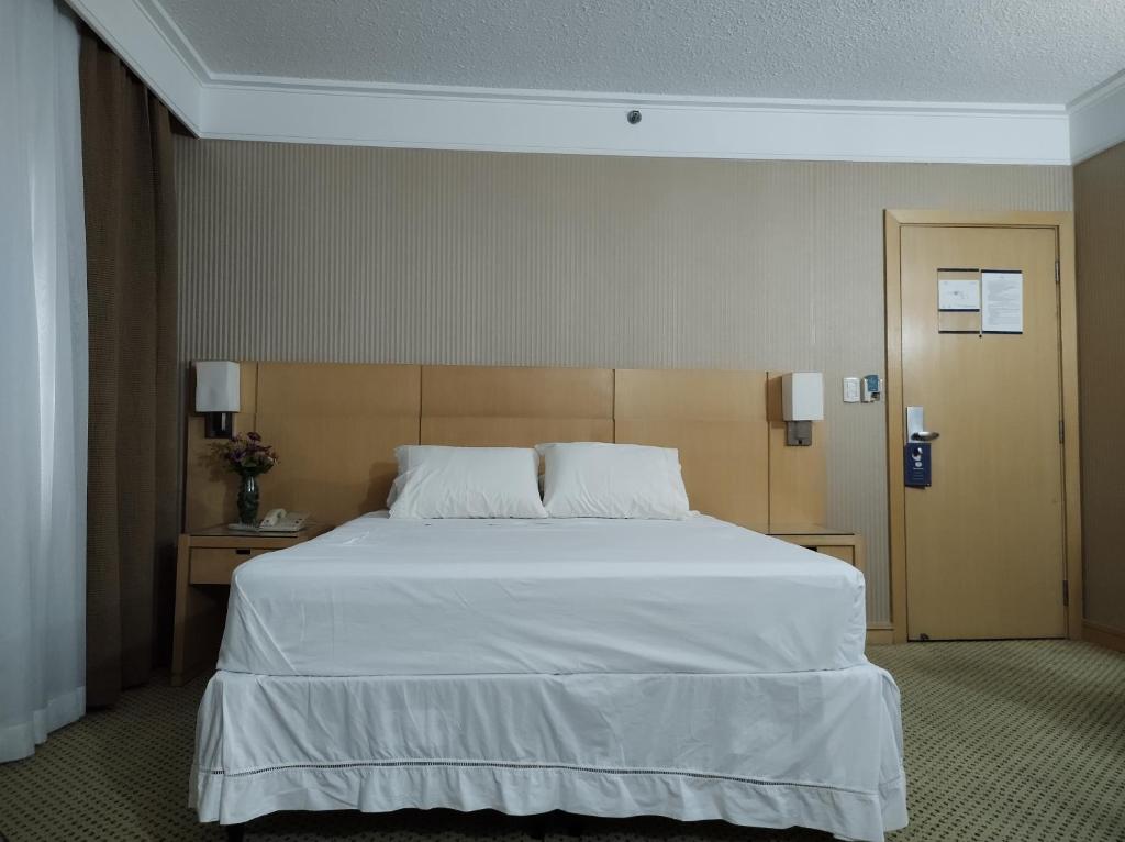 Ένα ή περισσότερα κρεβάτια σε δωμάτιο στο Flat Guarulhos