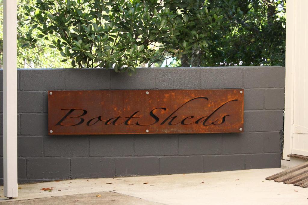 a sign on a wall that says boat shells at Boatsheds in Sawtell