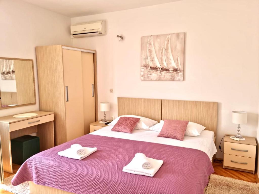 Posteľ alebo postele v izbe v ubytovaní Apartments Nikola Stipišić