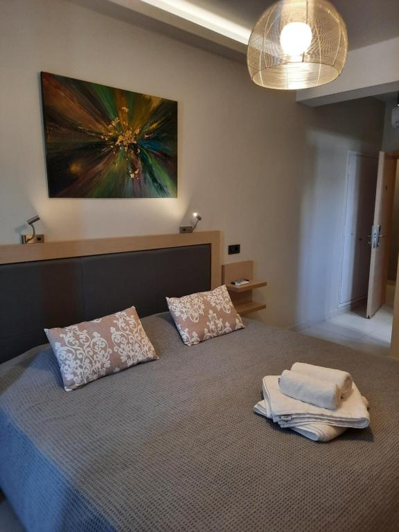 Postel nebo postele na pokoji v ubytování ANGELO Cafe Hotel