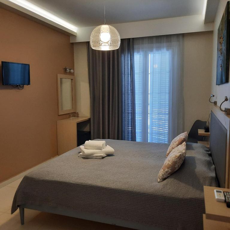 Postel nebo postele na pokoji v ubytování ANGELO Cafe Hotel