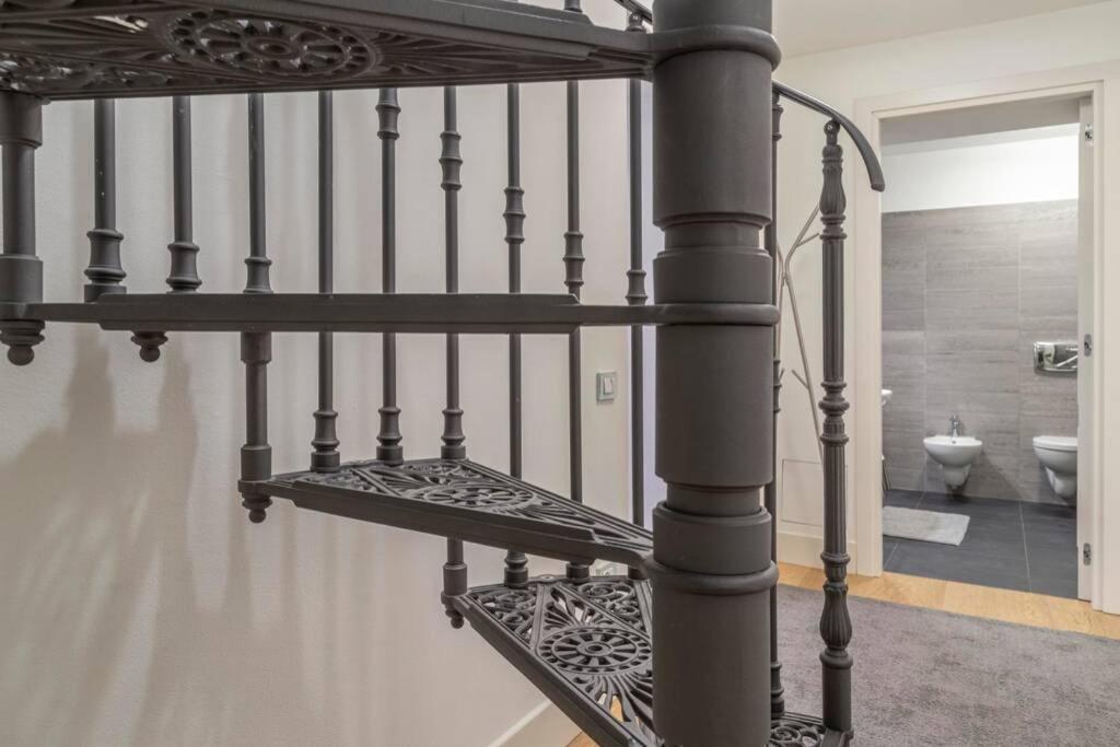Posteľ alebo postele v izbe v ubytovaní Palazzo Tergesteo Tirabora Suite Apartments