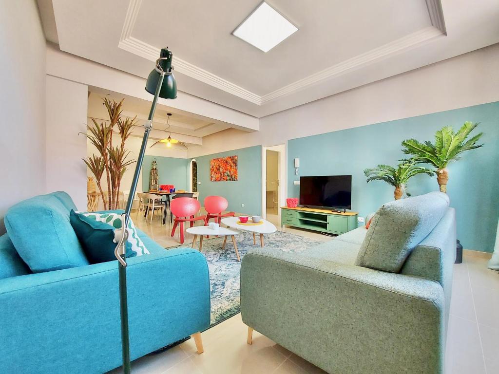 Televízia a/alebo spoločenská miestnosť v ubytovaní Aromas Suites Apartments