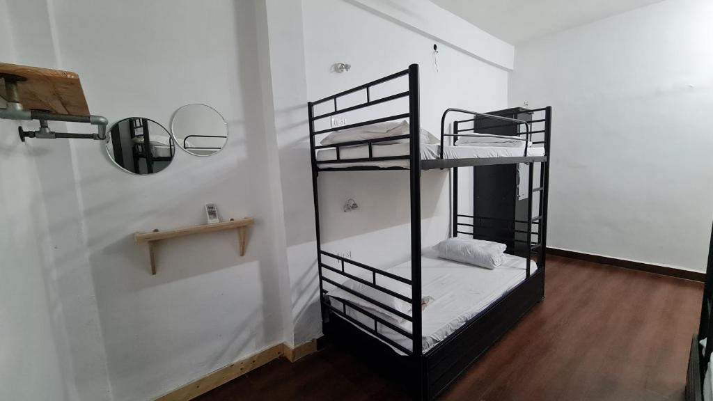Postel nebo postele na pokoji v ubytování HOSHTEL99 - PRIME - Stay, Cowork and Cafe