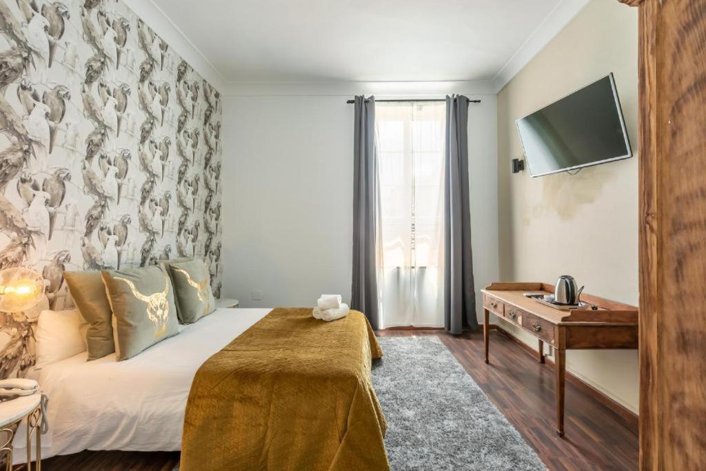 Posteľ alebo postele v izbe v ubytovaní Catedral Suites Jerez