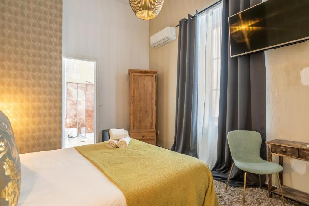 Posteľ alebo postele v izbe v ubytovaní Catedral Suites Jerez