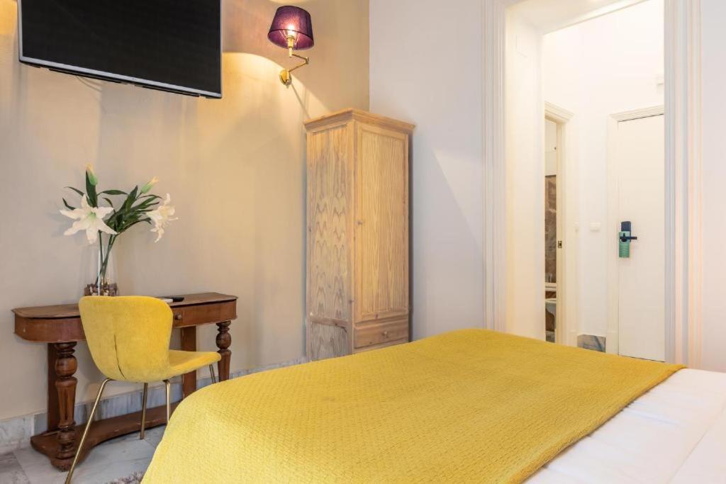 Posteľ alebo postele v izbe v ubytovaní Catedral Suites Jerez