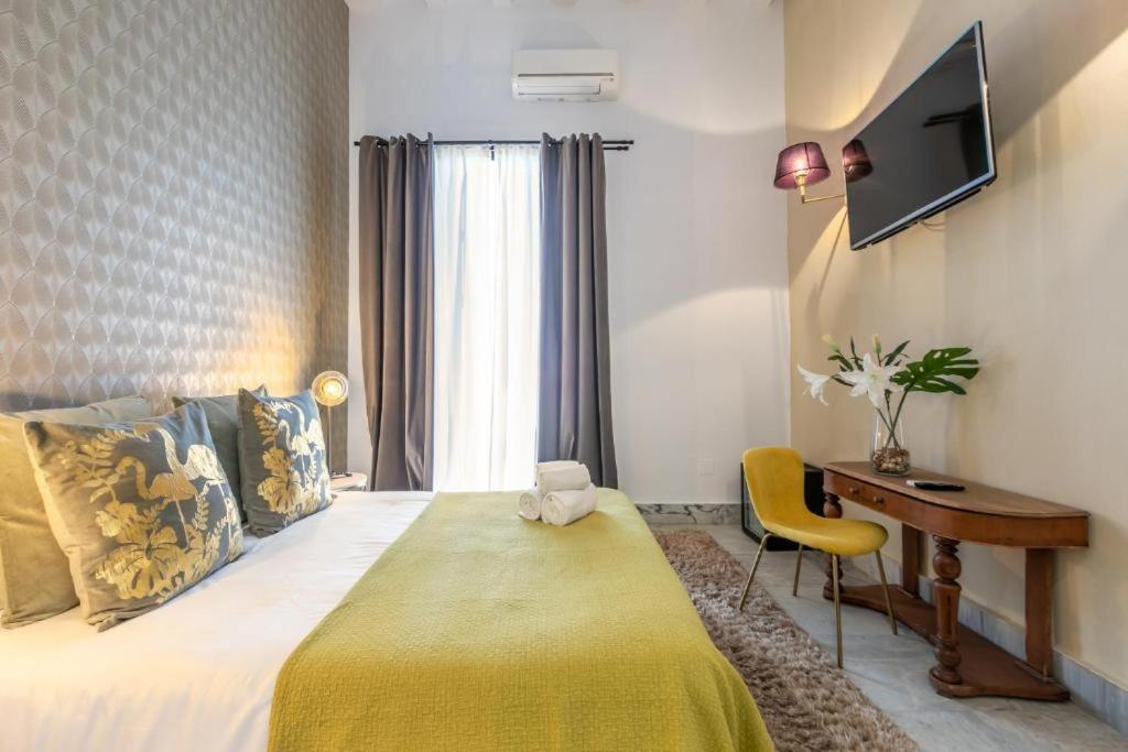 Posteľ alebo postele v izbe v ubytovaní Catedral Suites Jerez