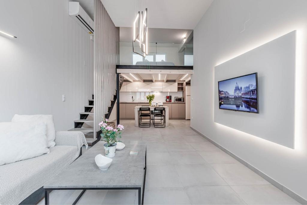 a living room with a couch and a table at Olea Apartment in Corfu Town