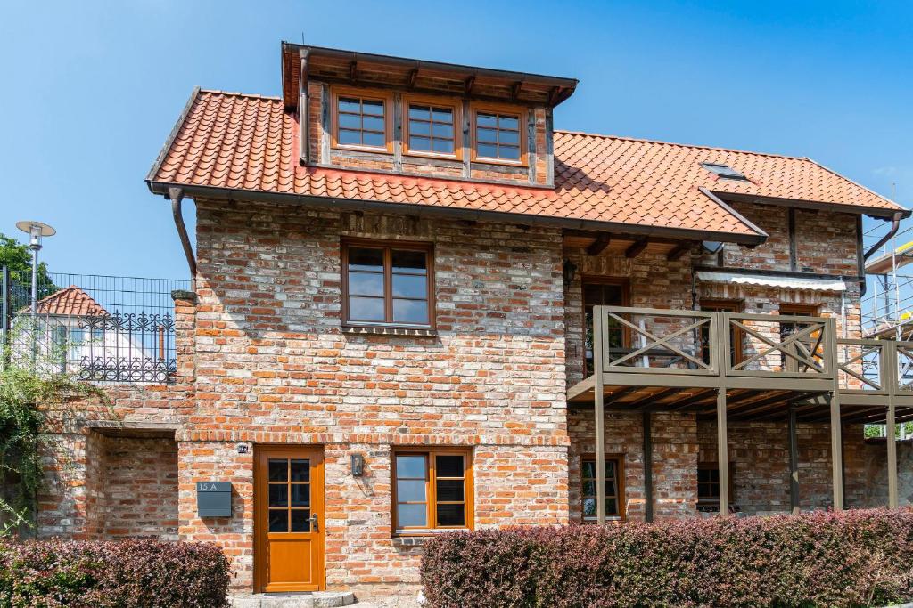 a brick house with a red roof at Superior in Bad Segeberg