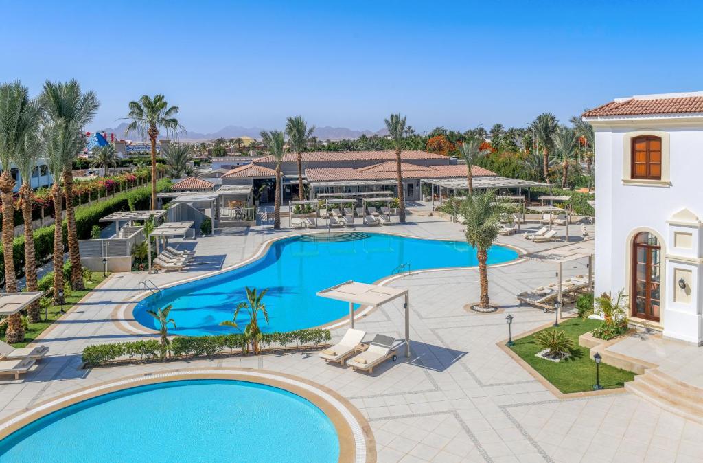 an overhead view of a pool at a resort at Jaz Fanara Residence in Sharm El Sheikh