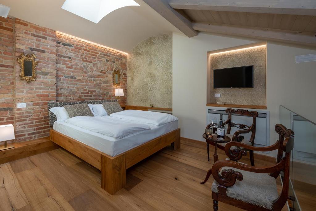 Postel nebo postele na pokoji v ubytování Sunstar Hotel Piemont Castello di Villa