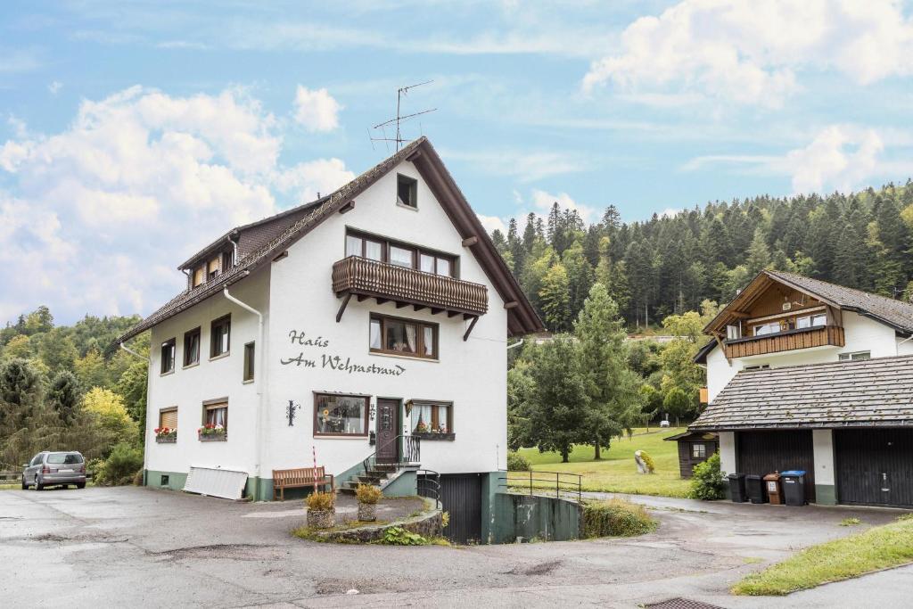 a white building with a sign that reads home of the indians at Am Wehrastrand App 5 in Todtmoos