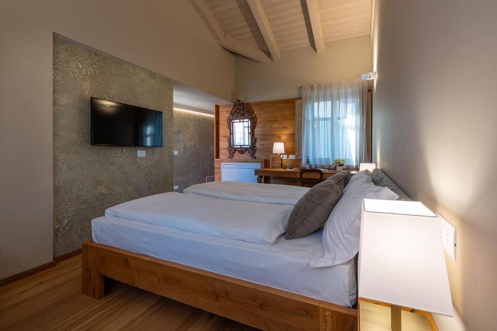 Postel nebo postele na pokoji v ubytování Sunstar Hotel Piemont Castello di Villa