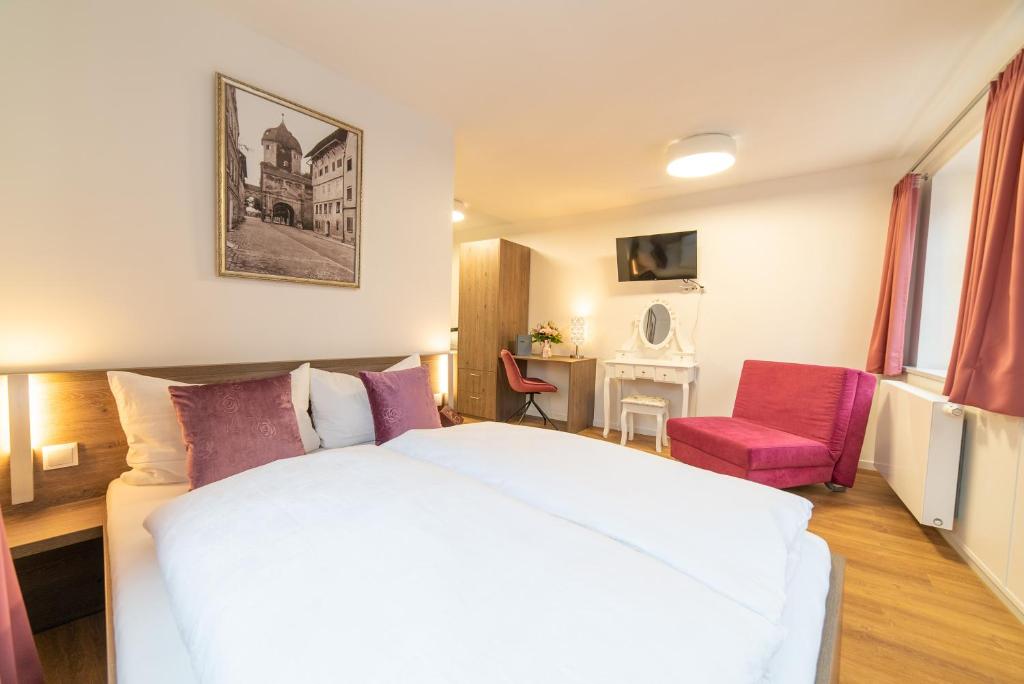 Postel nebo postele na pokoji v ubytování Urban Flair Hotel