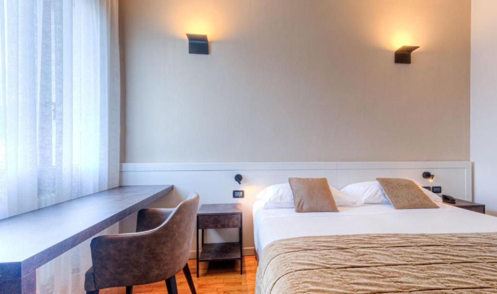 Postel nebo postele na pokoji v ubytování Hotel Belvedere Thiene
