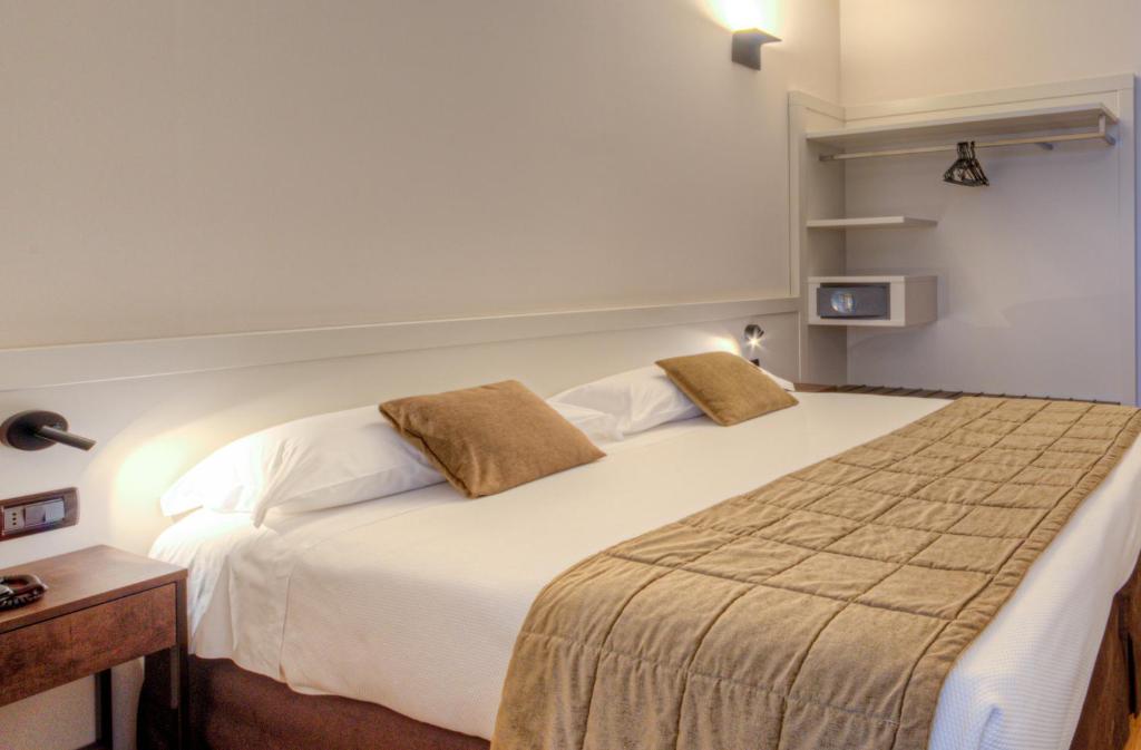 Postel nebo postele na pokoji v ubytování Hotel Belvedere Thiene