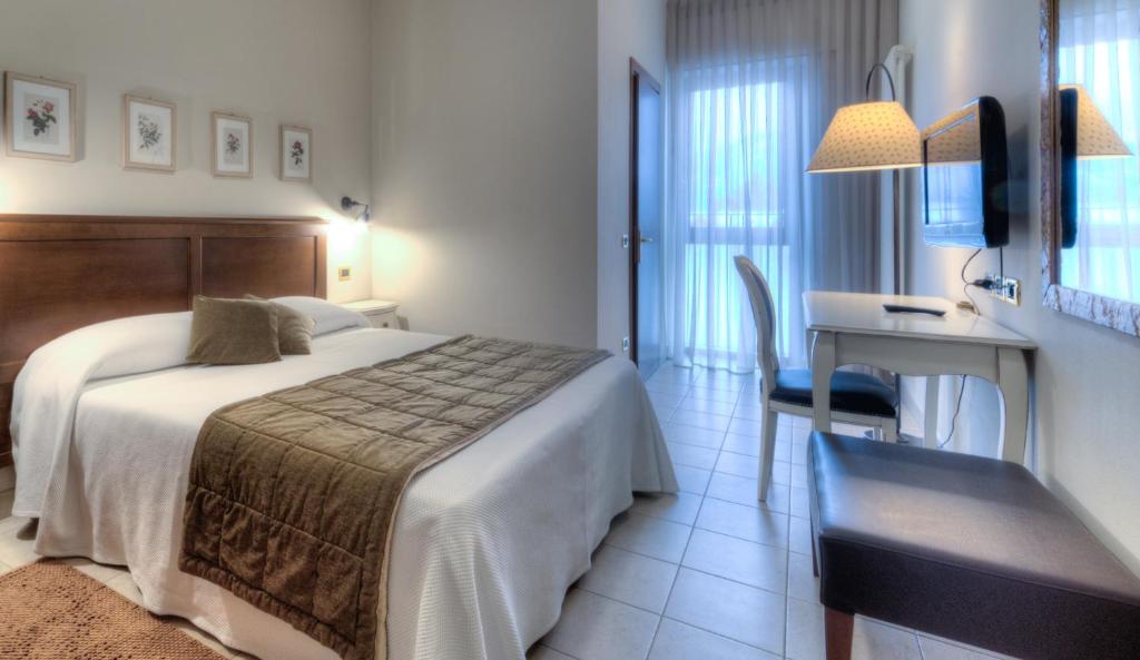 Postel nebo postele na pokoji v ubytování Hotel Belvedere Thiene