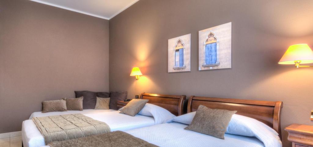 Postel nebo postele na pokoji v ubytování Hotel Belvedere Thiene