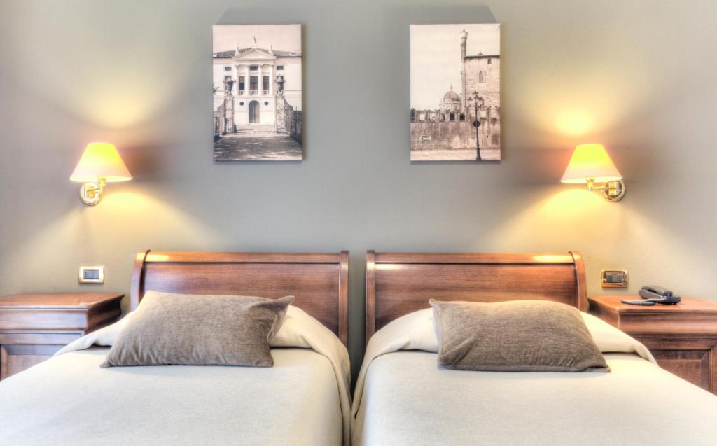 Postel nebo postele na pokoji v ubytování Hotel Belvedere Thiene