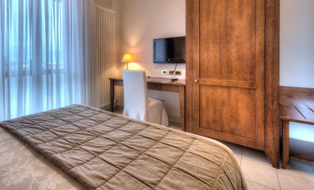 Postel nebo postele na pokoji v ubytování Hotel Belvedere Thiene
