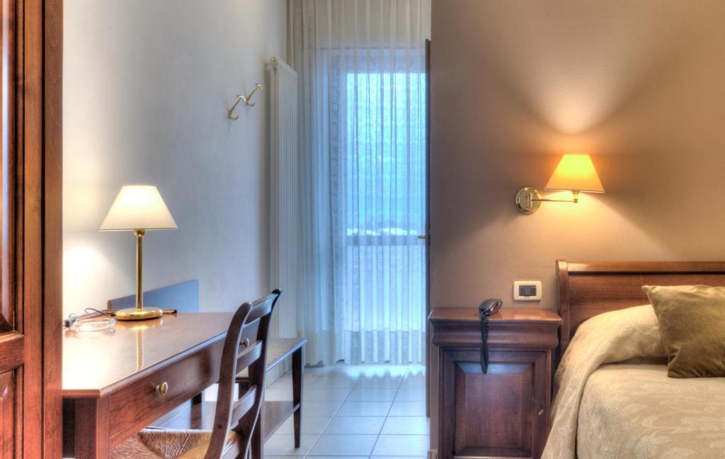 Postel nebo postele na pokoji v ubytování Hotel Belvedere Thiene
