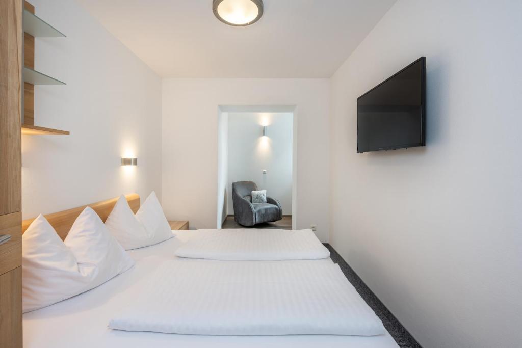 Posteľ alebo postele v izbe v ubytovaní Appartements Insieme