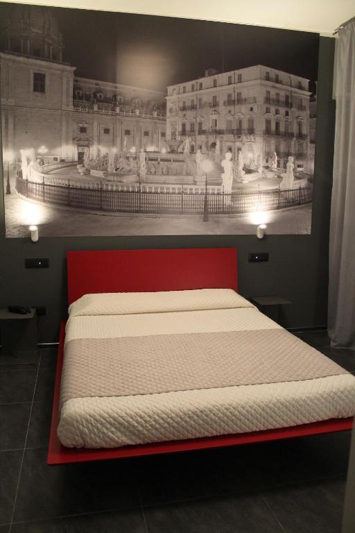 Postel nebo postele na pokoji v ubytování Alma Hotel