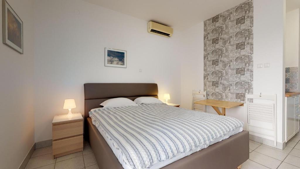 Posteľ alebo postele v izbe v ubytovaní Apartments Lantina