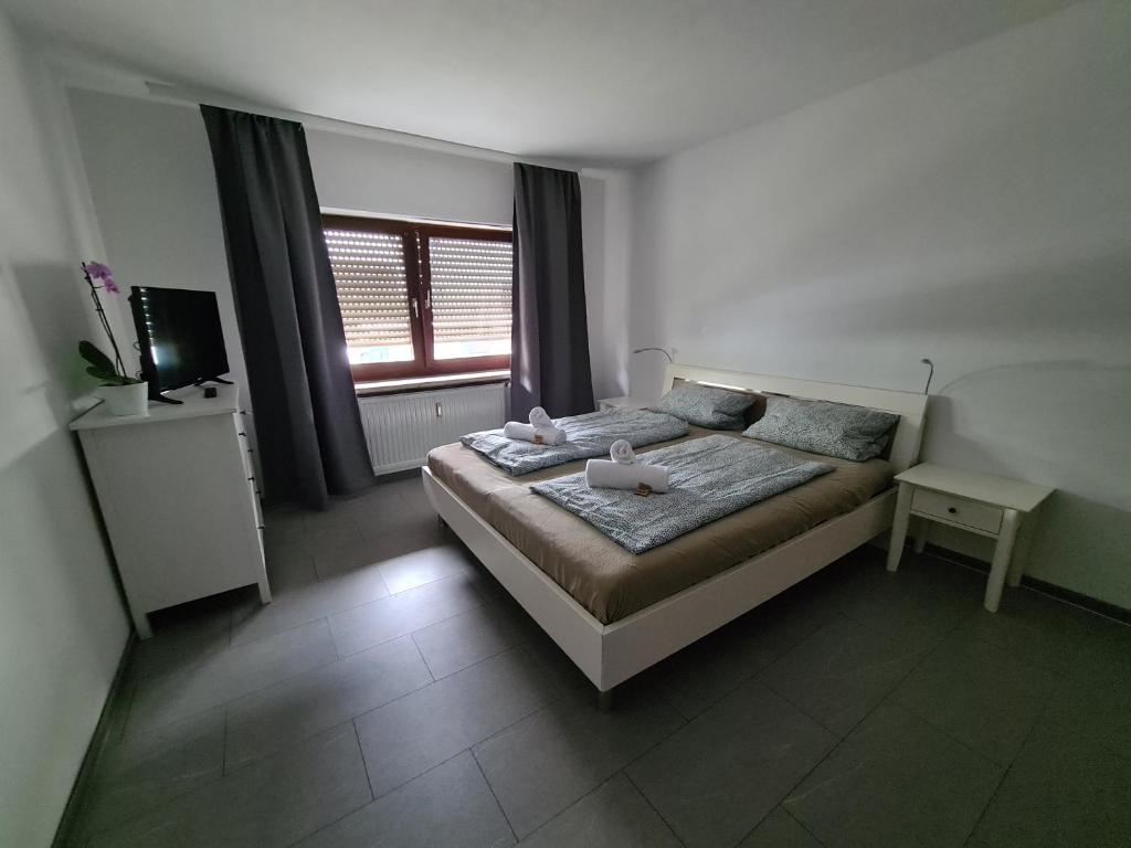 Postel nebo postele na pokoji v ubytování Ferienwohnung Schwetzingen