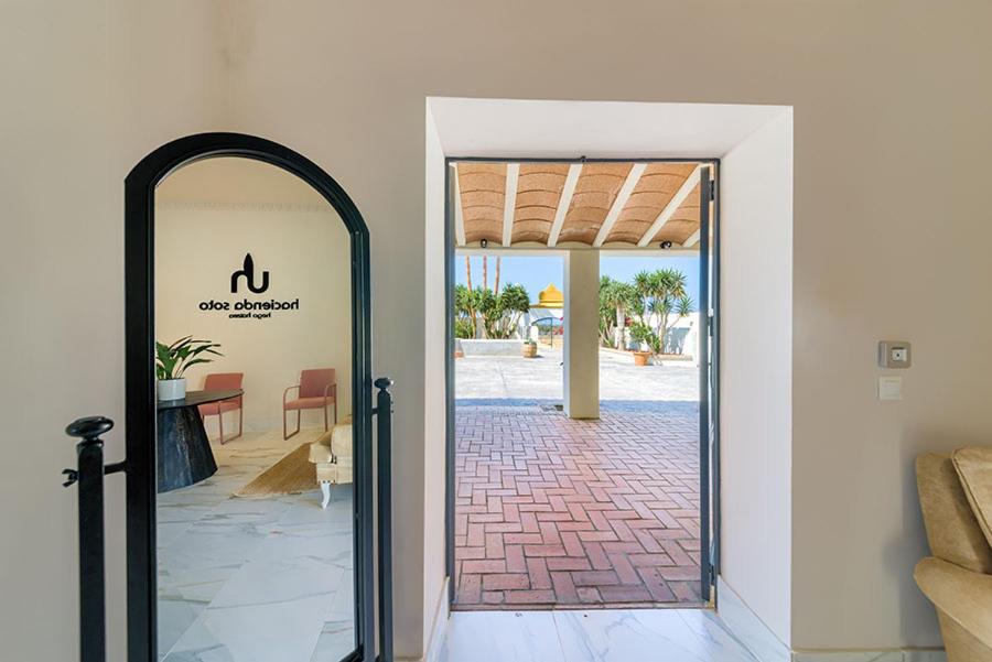 an open door to a room with a patio at Hacienda Soto-Hego Haizea in Chiclana de la Frontera