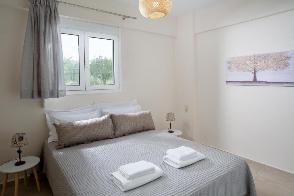 Posteľ alebo postele v izbe v ubytovaní Kymata Apartment Ierapetra