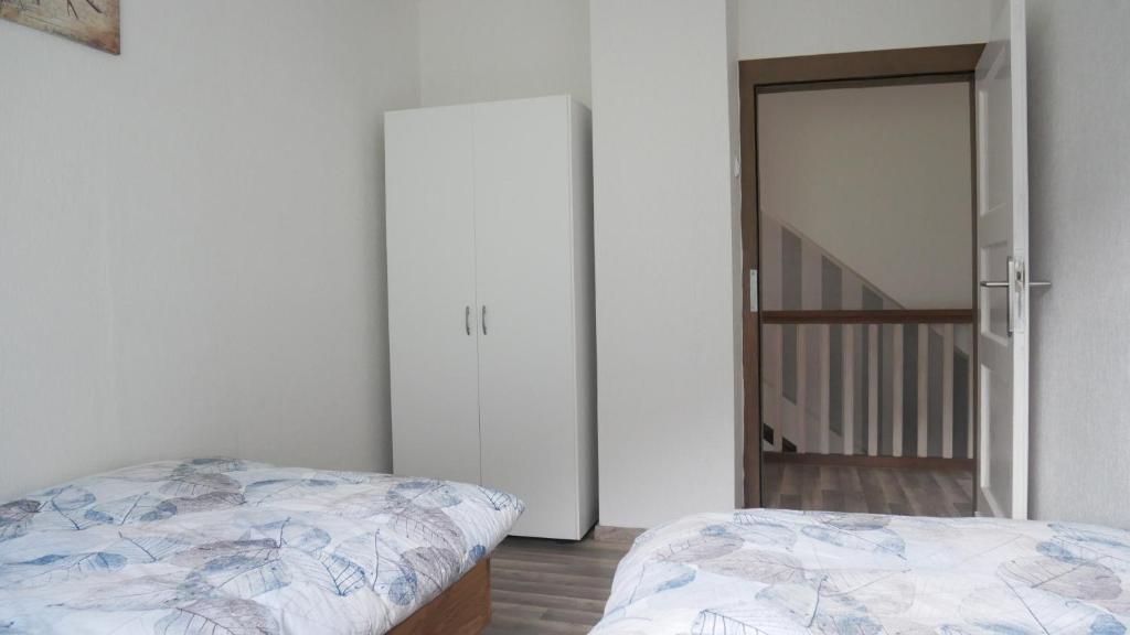 Postel nebo postele na pokoji v ubytování Modernisierte Ferienwohnung im schönen Sauerland