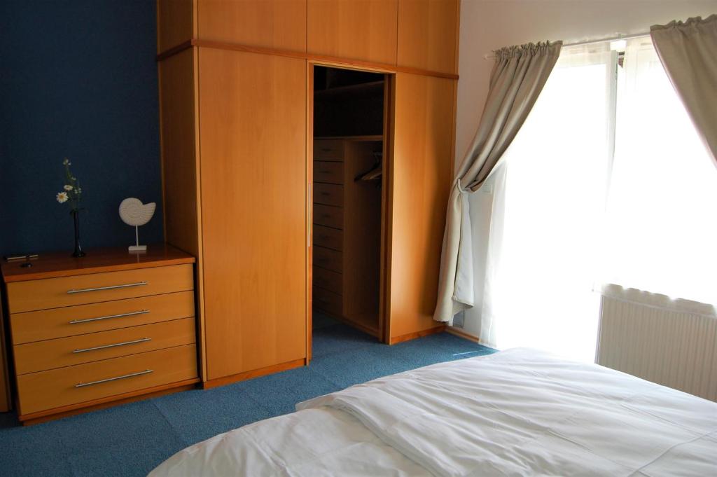 Postel nebo postele na pokoji v ubytování Fado Apartments Lendava