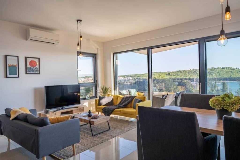 a living room with a couch and a table at Apartment Emarin in Banjole