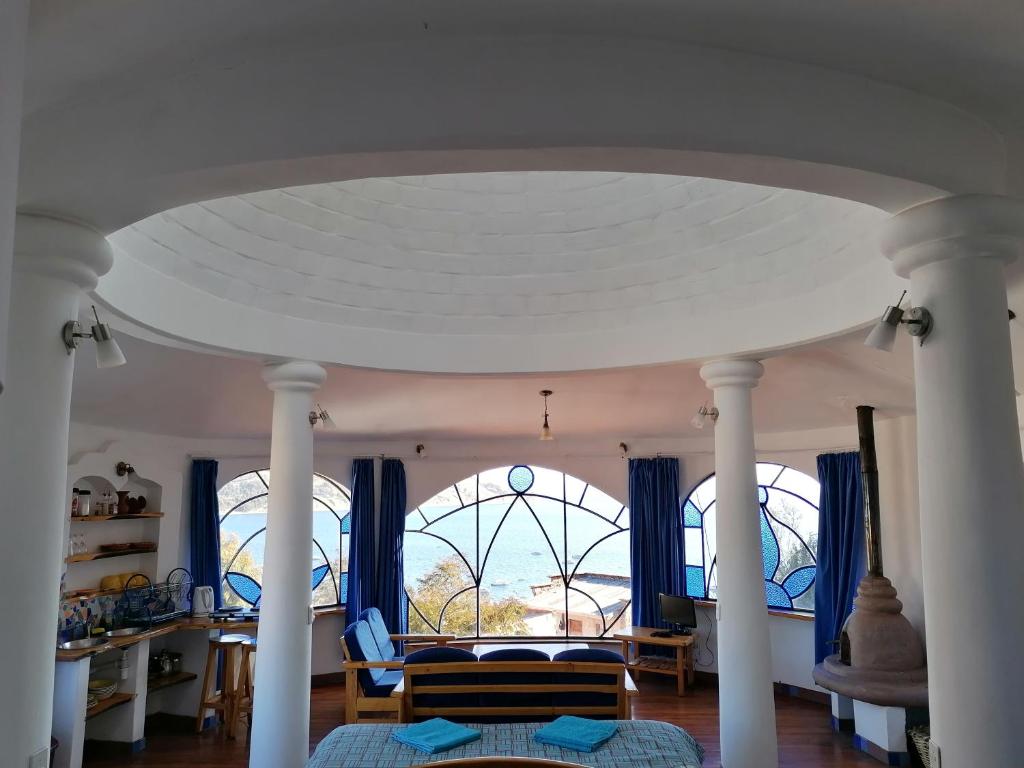 Postel nebo postele na pokoji v ubytování Hostal Las Olas