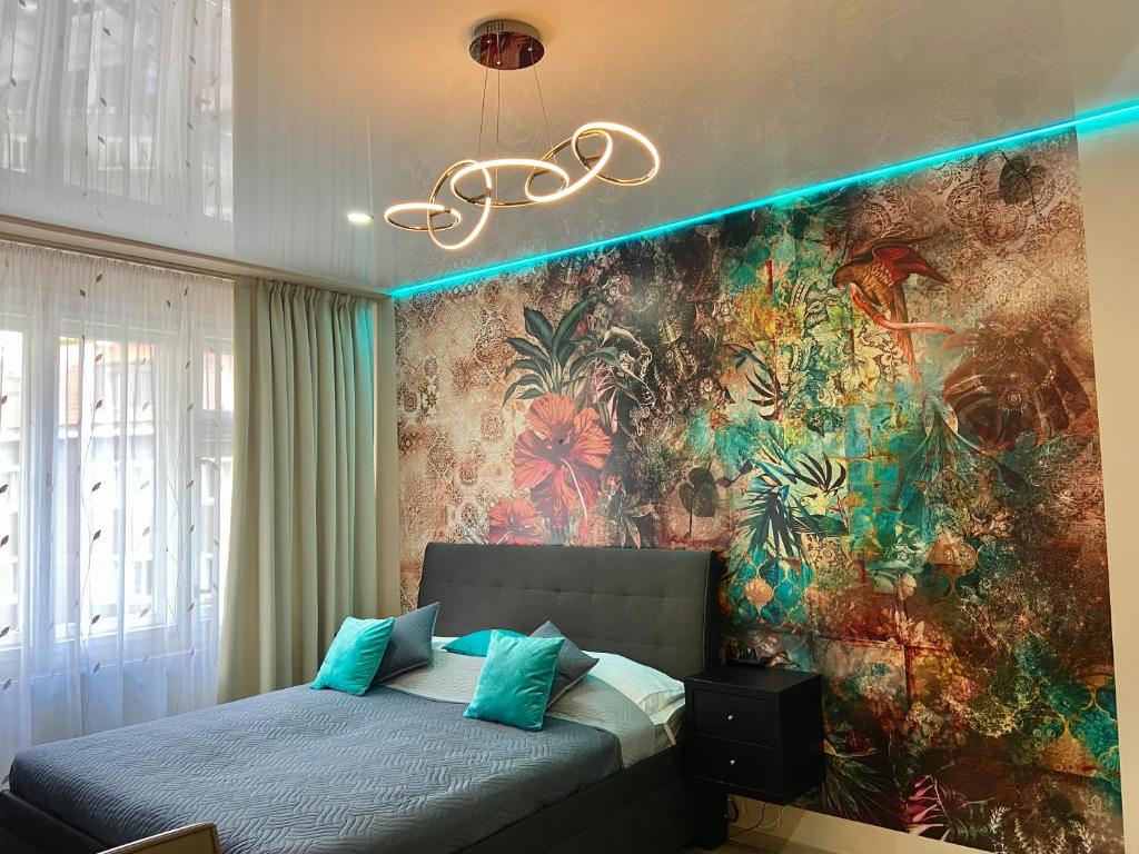 Postel nebo postele na pokoji v ubytování Lokal apartment
