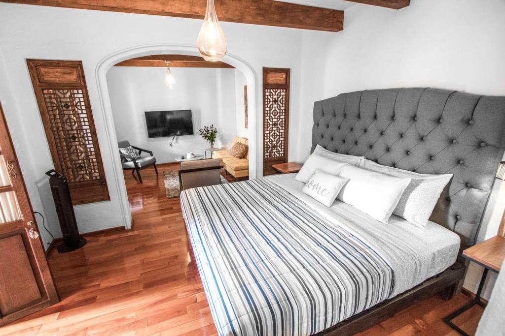 מיטה או מיטות בחדר ב-Bello atardecer - hotel boutique
