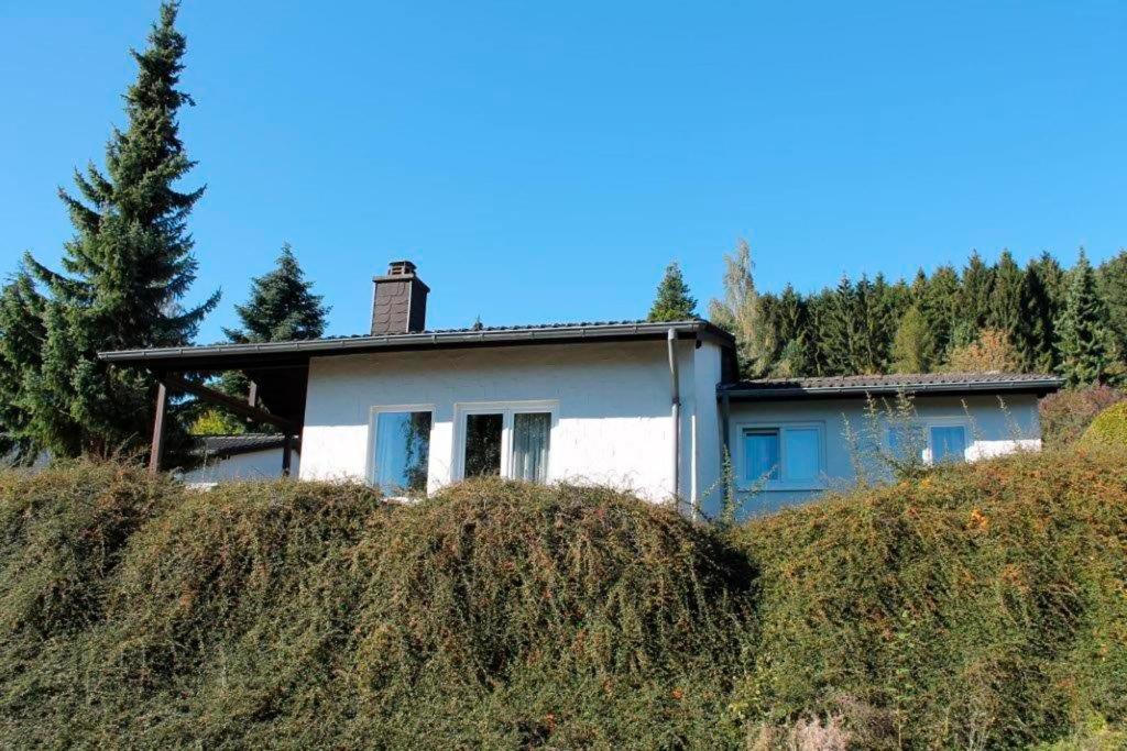 a house sitting on top of a hill at Landhaus Seeblick in Biersdorf
