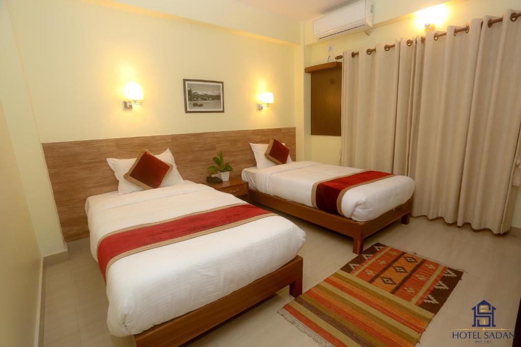 Katil atau katil-katil dalam bilik di Hotel Sadan