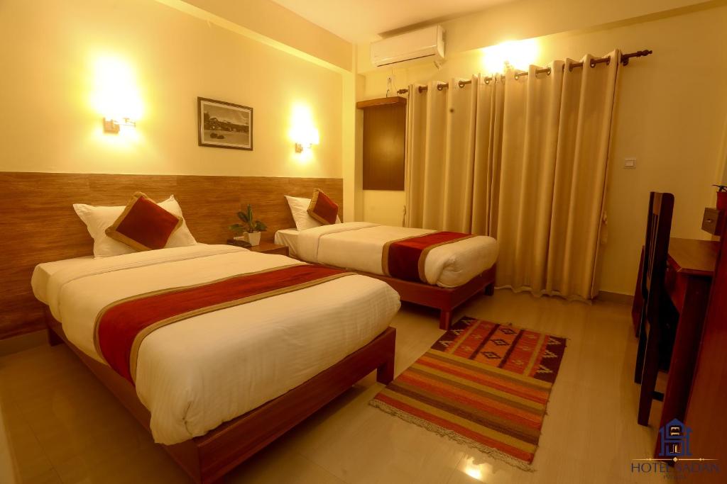 Katil atau katil-katil dalam bilik di Hotel Sadan