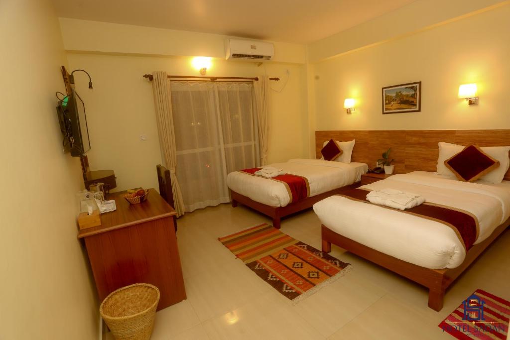 Katil atau katil-katil dalam bilik di Hotel Sadan